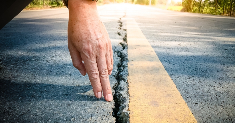 Cracked asphalt road surface