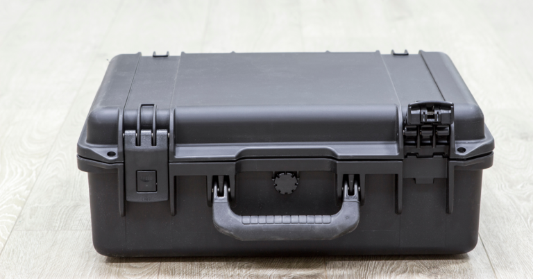 Closed black rugged equipment hard case on a workbench